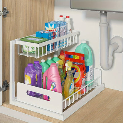 white pull out sliding cabinet caddy under a kitchen sink