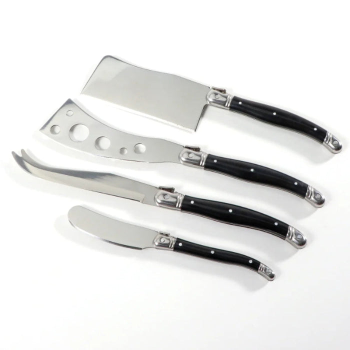 Set of four cheese knives with black handles on a white background