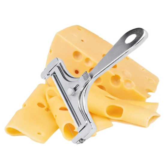 Cheese slicer with a block of Swiss cheese on a white background