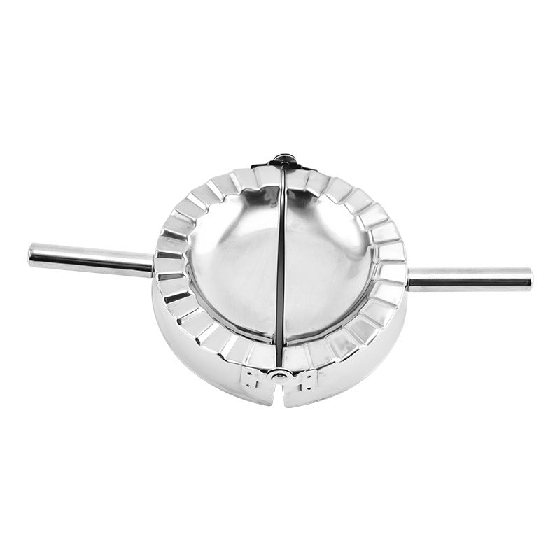 Metallic pie cutter on a white background