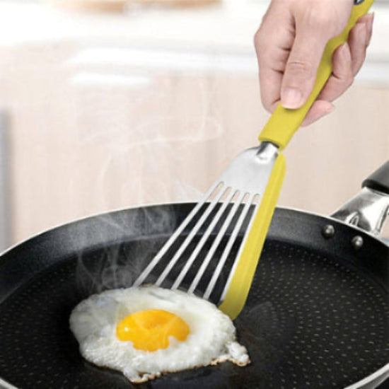 non-stick silicone edge spatula lifting an egg in a pan