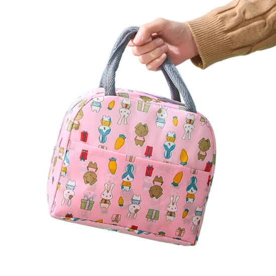 Pink bag with cartoon character pattern held by a hand on a white background