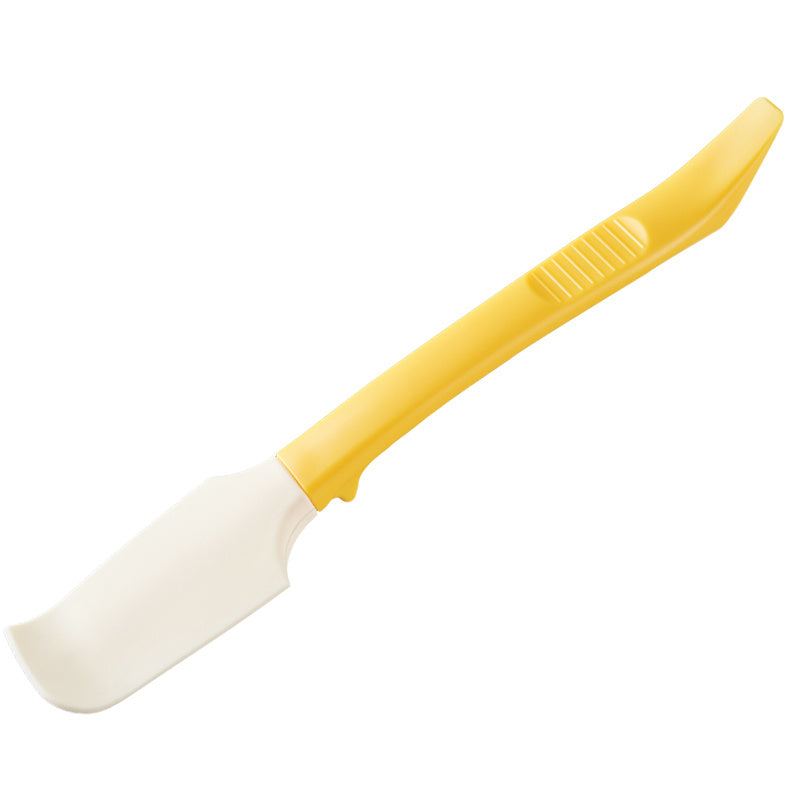 white silicone scraper tool with a yellow handle