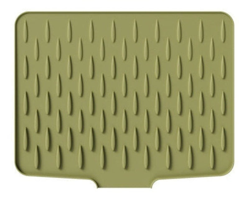 Green silicone mat with textured pattern on a white background