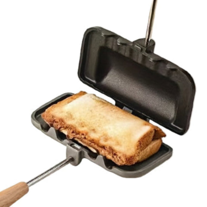 Compact grill with bread inside on a white background