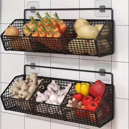 Two black wire baskets with vegetables on a tiled wall