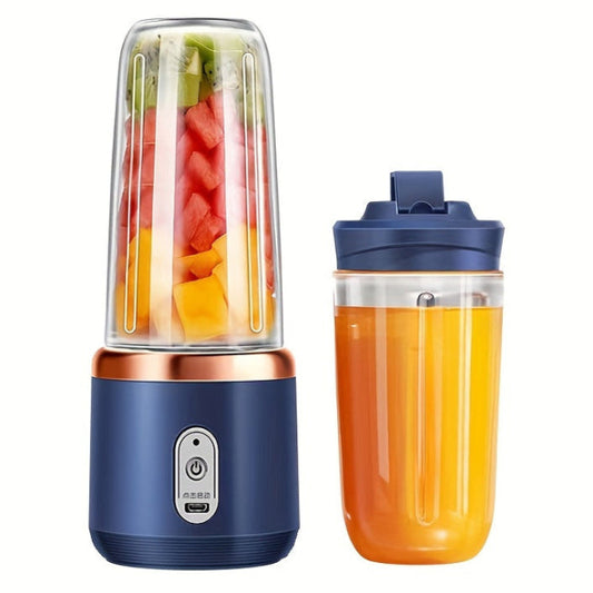 Portable blender with a container filled with fruits and a separate container of juice on a white background
