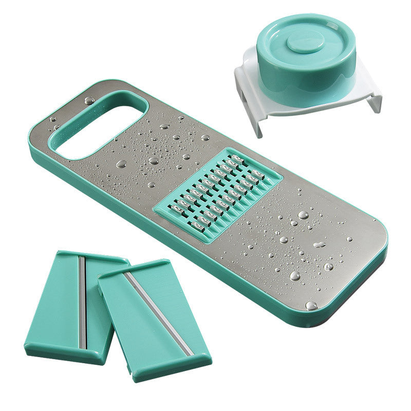 Teal and gray vegetable chopper with attachments on a white background