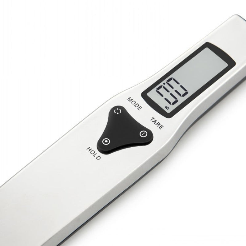 Digital kitchen spoon scale with a white background