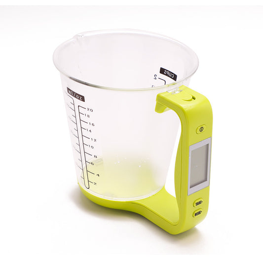 transparent measuring scale jug with a green handle