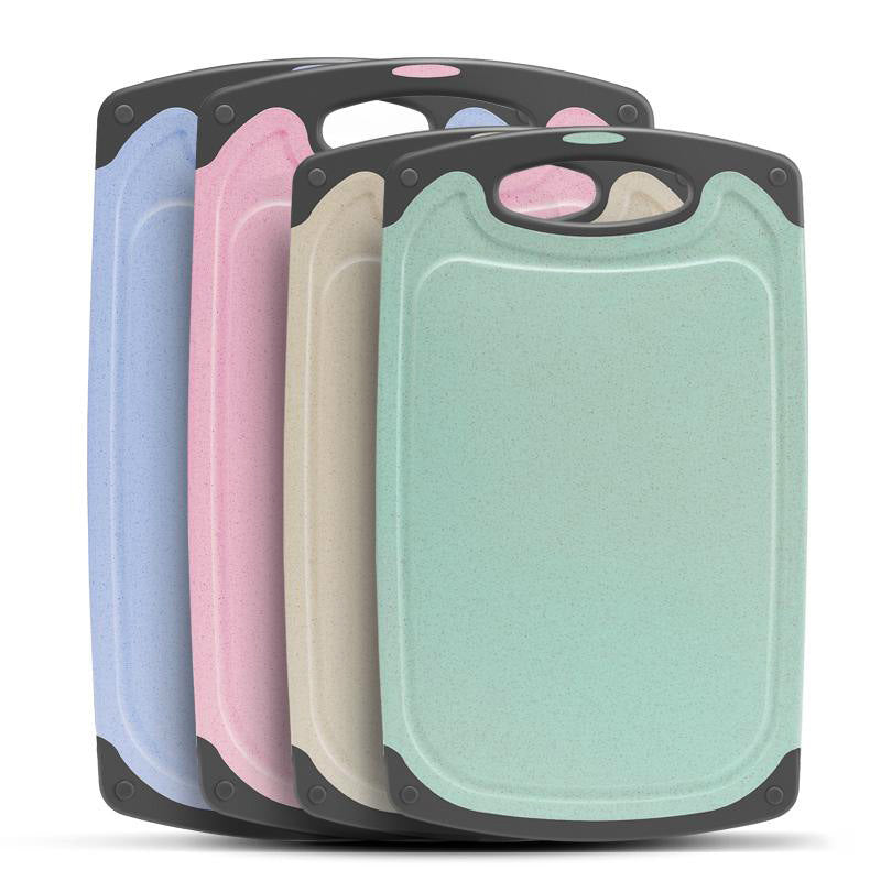 pink, blue, beige and green wheat fibre cutting boards with grey handles
