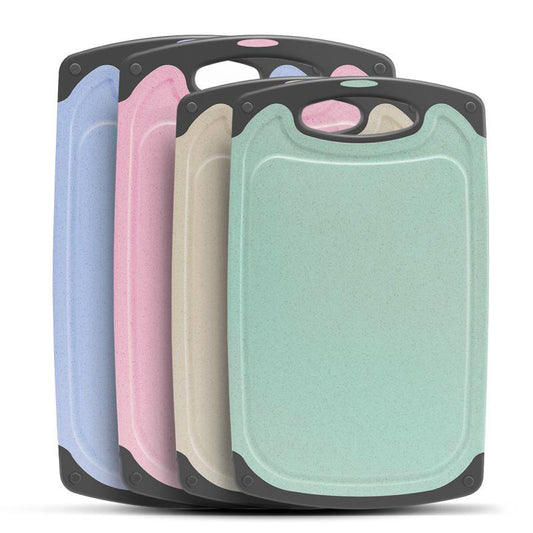 pink, blue, beige and green wheat fibre cutting boards with grey handles