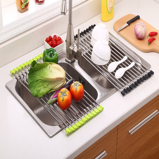 two steel sink racks on a kitchen sink with crockery and vegetables