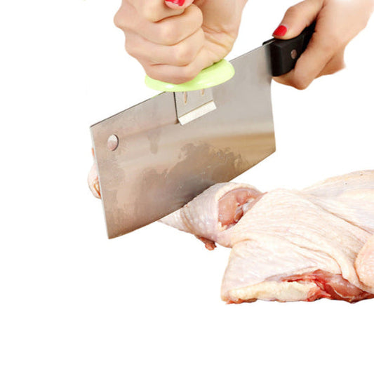green clip on hand guard on a cleaver with a person chopping chicken
