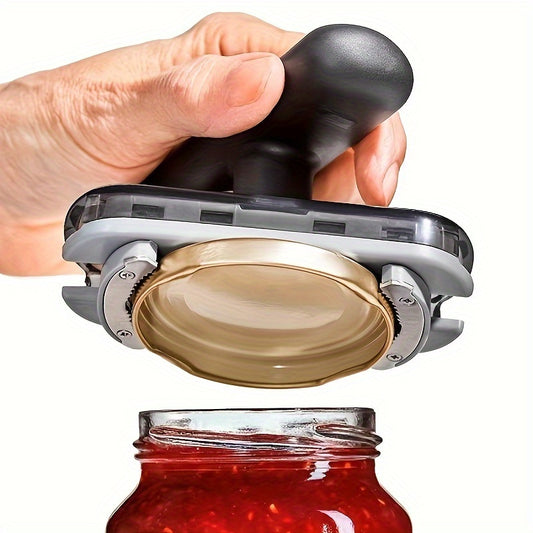 Hand using a black jar opener on a white background