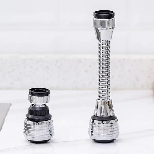 Two chrome kitchen faucet extenders on a white marble surface