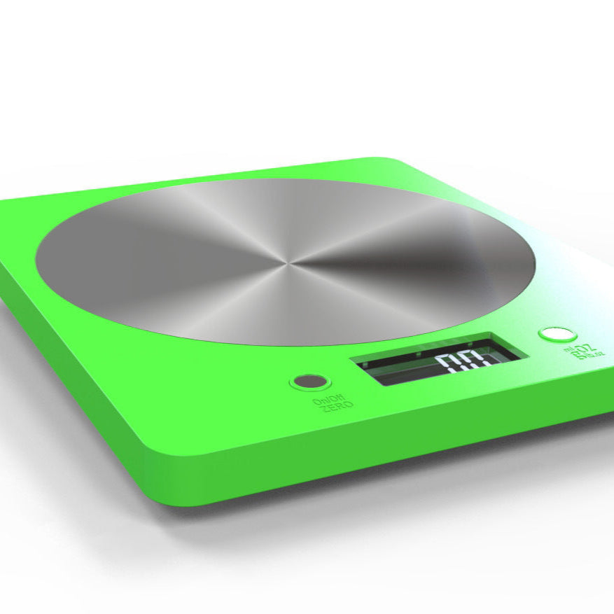 Green electronic scale with a metallic surface on a white background