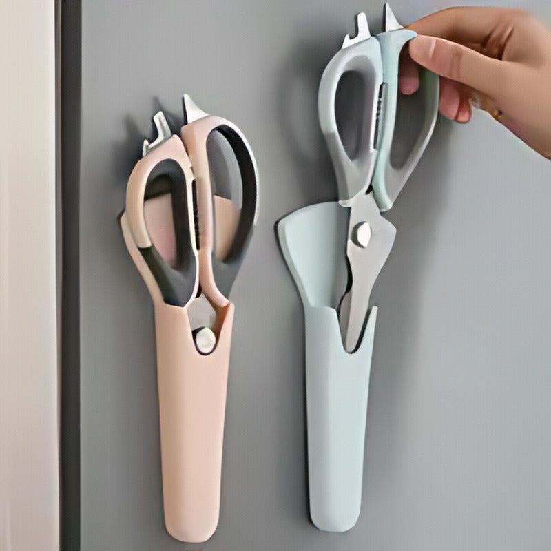 green and pink kitchen scissors in green and pink mounted holders