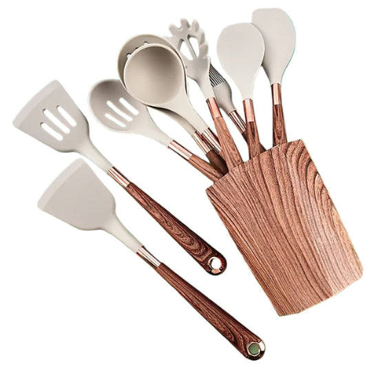 Set of kitchen utensils with wooden handles on a colorful background