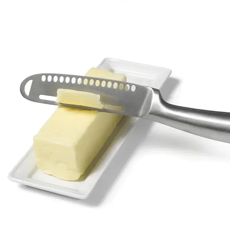 stainless steel butter knife slicing butter