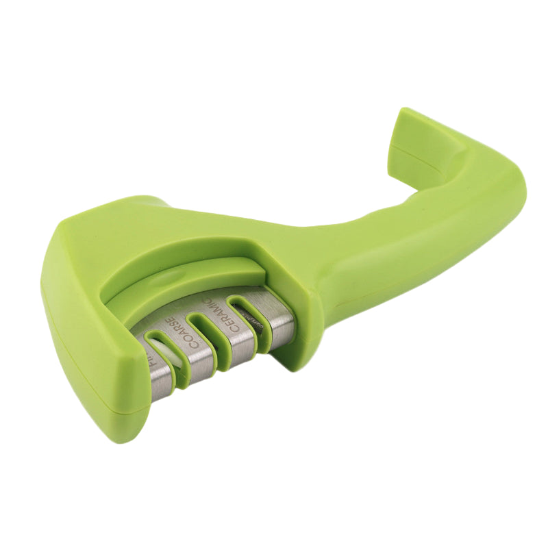 Green knife sharpener with metallic blades on a white background