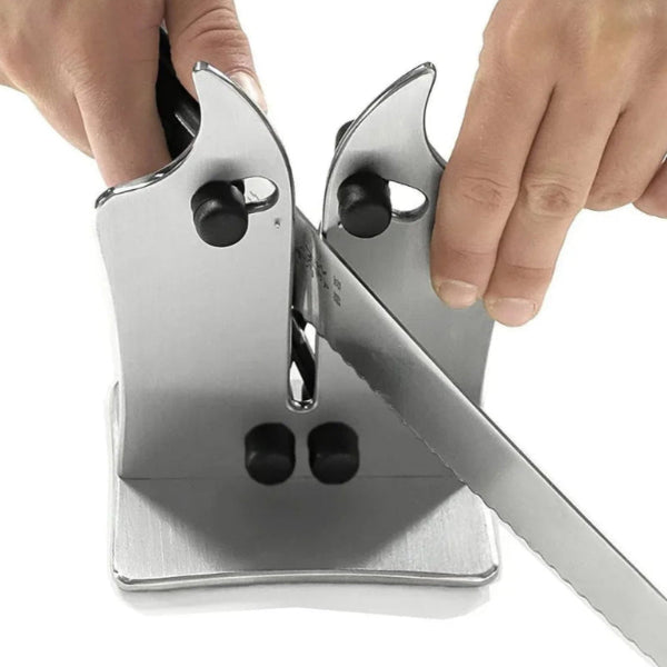 Knife sharpener being used with a knife on a white background