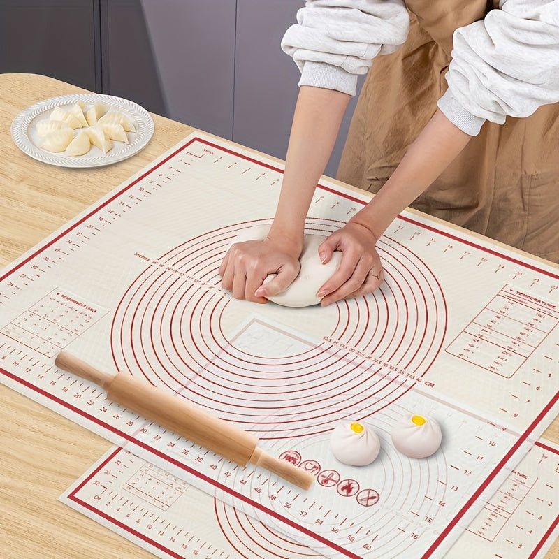 Person rolling dough on a baking mat with a wooden rolling pin.