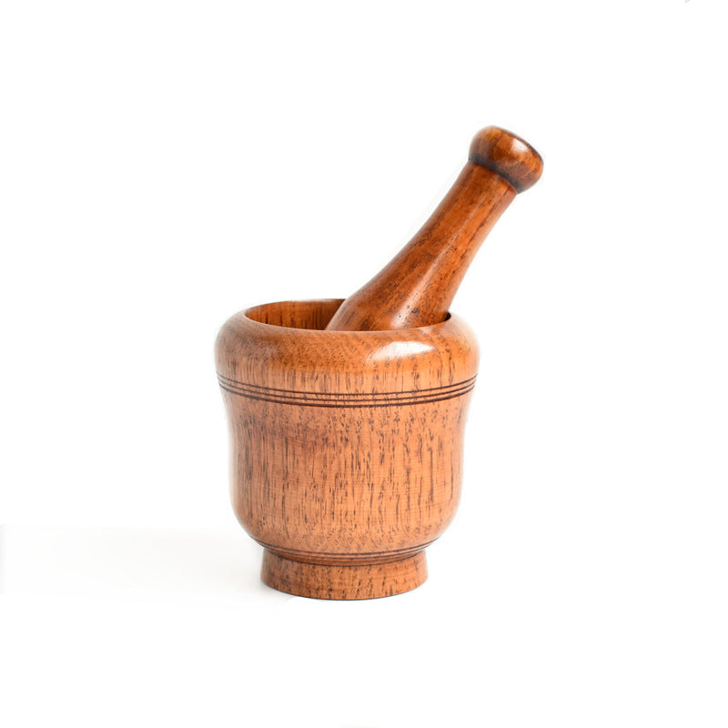 Wooden mortar and pestle on a white background