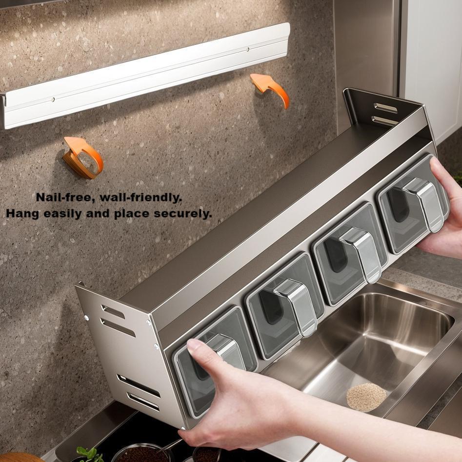 Kitchen storage solution with hooks attached to a wall above a sink.