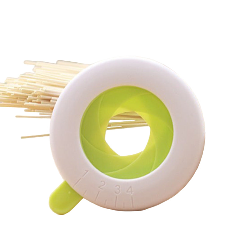 spaghetti being measured in a white and green circular measuring tool