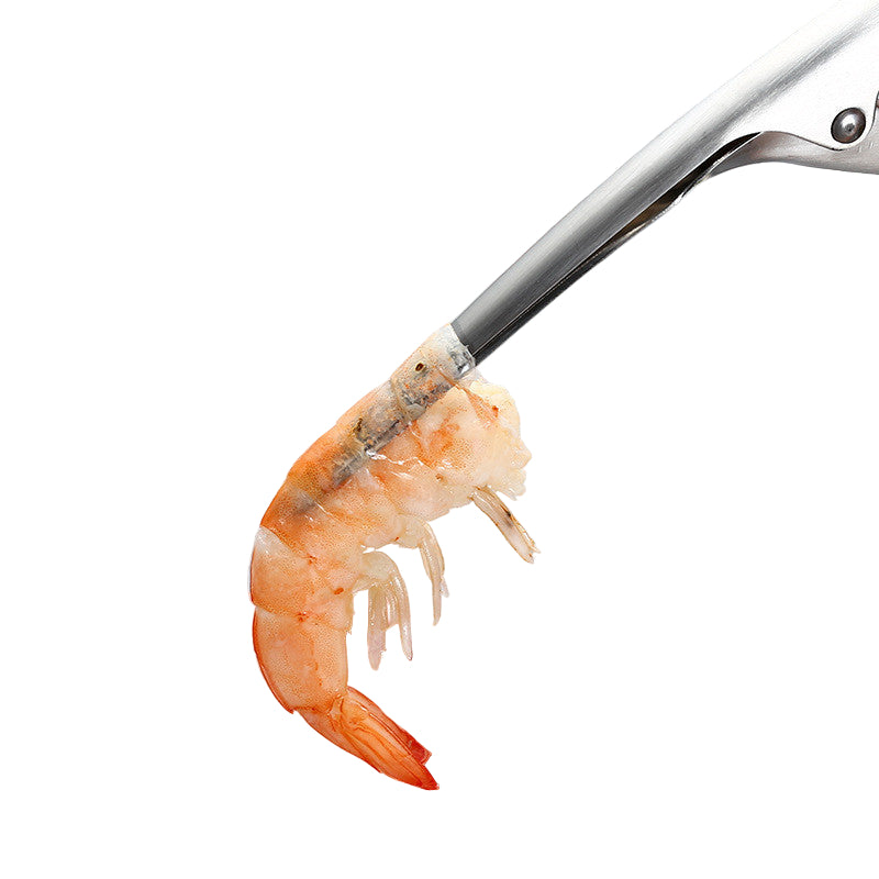 stainless steel shrimp peeler with a shrimp shell on it