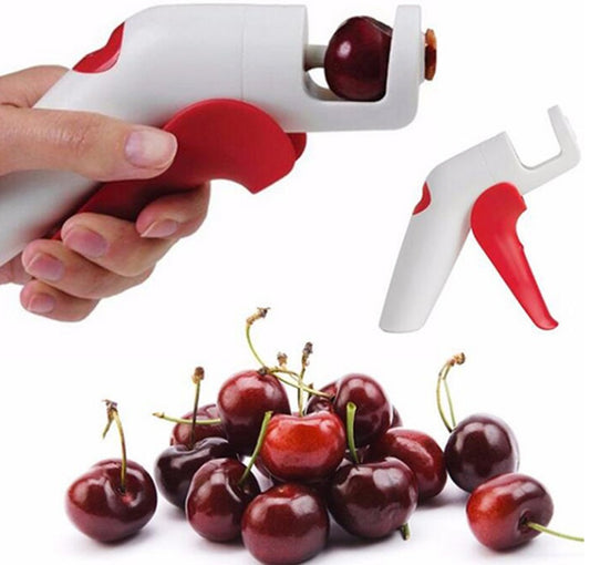 person pitting cherries with a cherry and olive pitter 