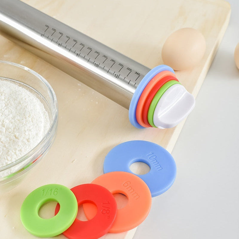 Rolling pin with colorful roller stops on a wooden board