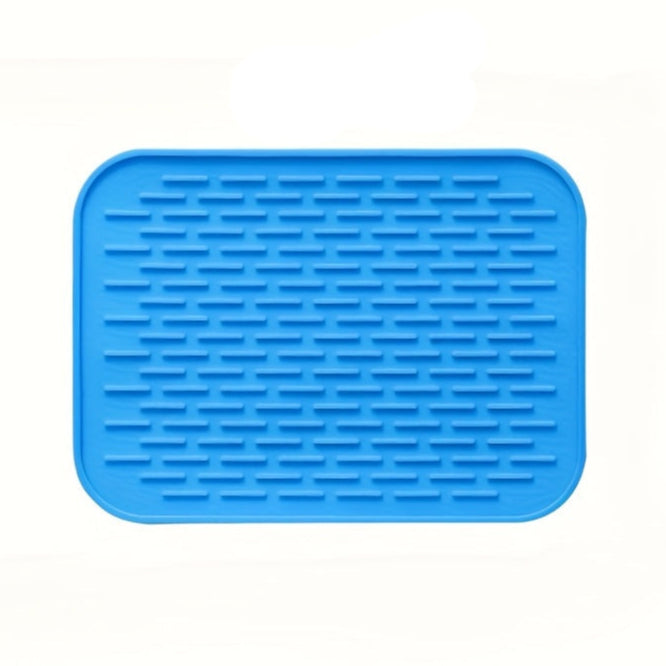 Blue silicone mat with textured surface on a white background