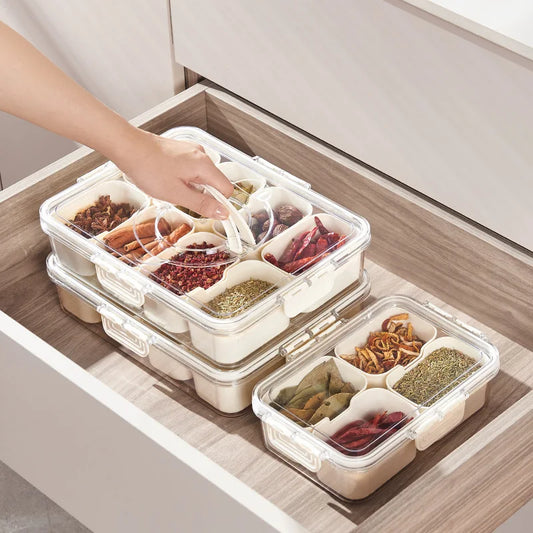 white 8 grid food storage containers in a wooden kitchen drawer