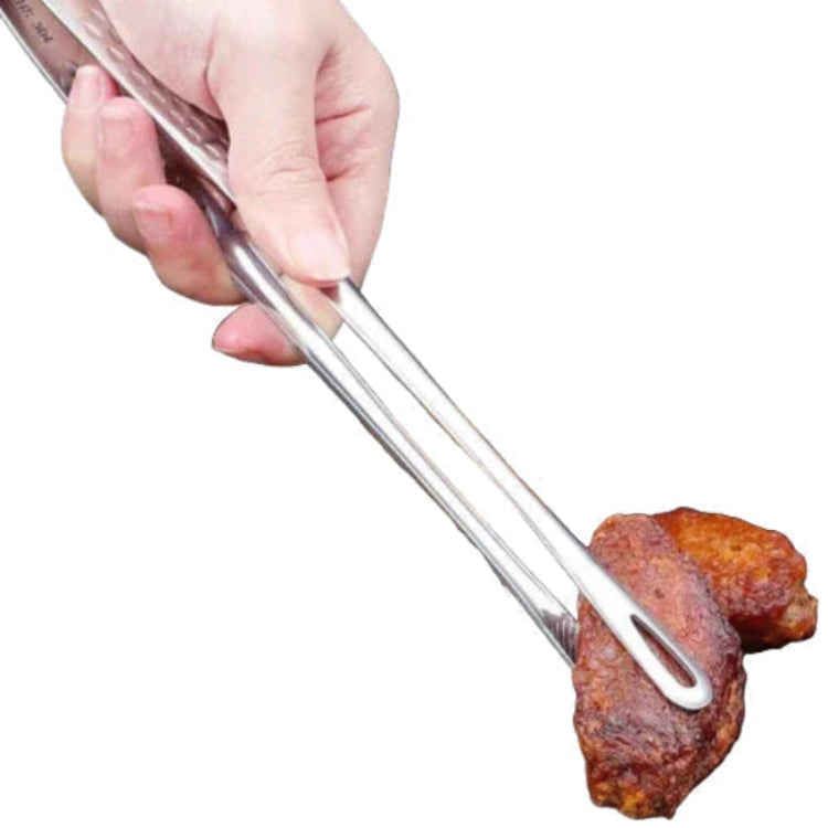 stainless steel non-slip bbq tongs holding a steak