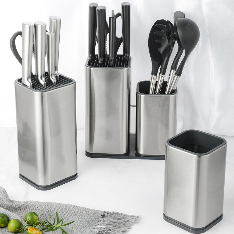 Set of stainless steel kitchen utensil holders with knives, spatulas, and other tools on a white background.