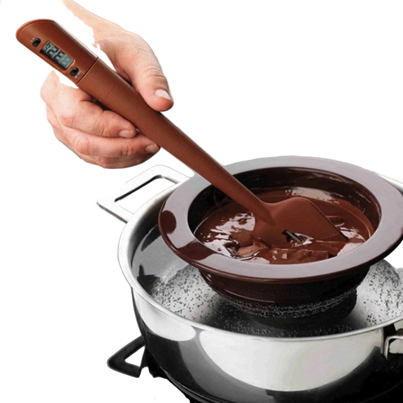 brown stirring spatula with thermometer stirring chocolate in a brown bowl