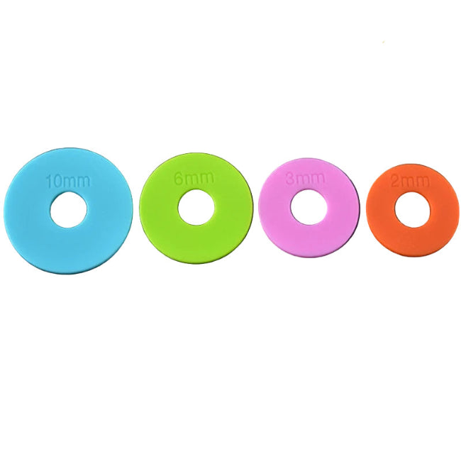 blue, green, pink and orange silicone measuring discs