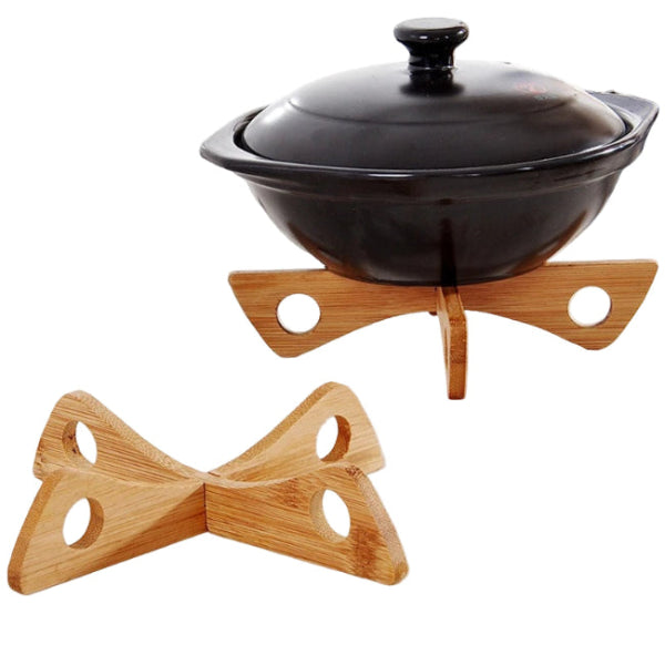 two wooden trivets one with a black dish