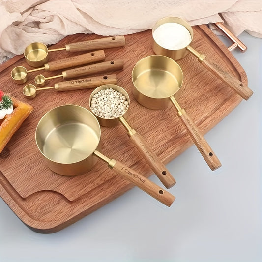 Set of brass measuring cups and spoons on a wooden cutting board.