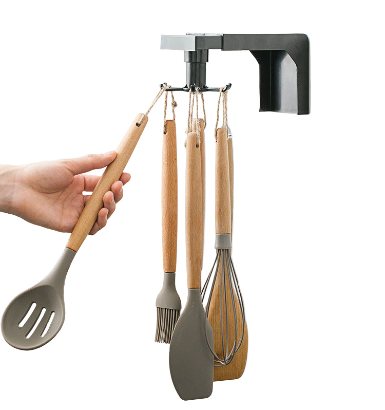 black wall mounted carousel kitchen utensil rack with silicone and wood utensils