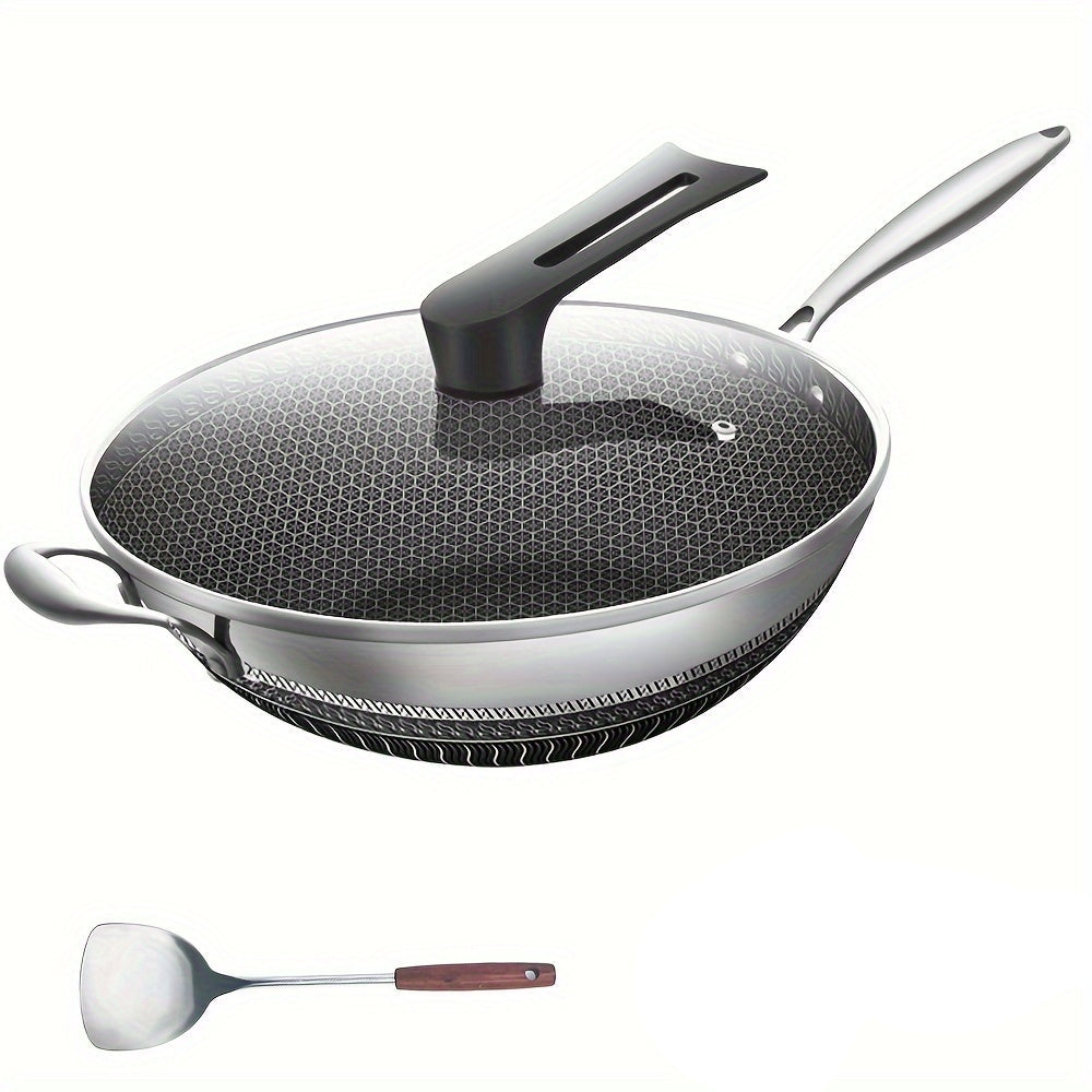 Wok with glass lid, spatula, and brush on a white background