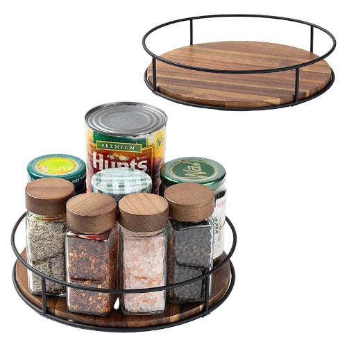 wood and steel revolving condiment tray with spice jars and condiments on a white background
