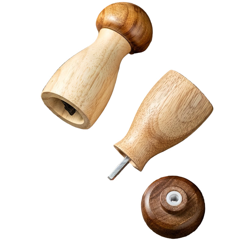Wooden pepper grinder on a wooden surface with spices and herbs around