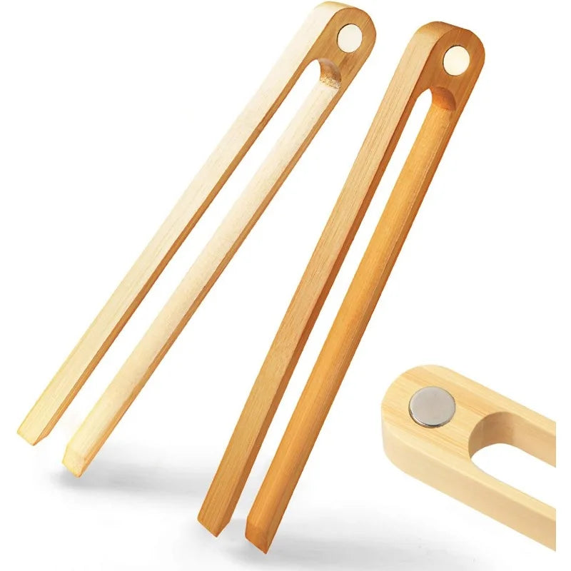 Set of wooden tongs on a white background